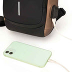 Smartphone securely placed in a dedicated, easy-access pocket inside the Basic Clothes Co. crossbody bag